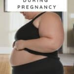 plus size woman standing with a pregnancy b belly