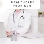 doctor sitting as desk with laptop
