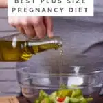 Woman pouring oil on a salad