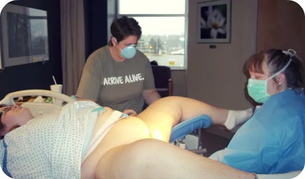 plus size woman giving birth on her back