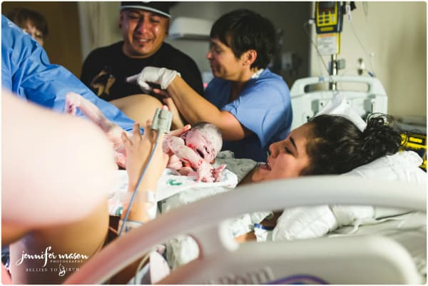 plus size hispanic woman giving birth