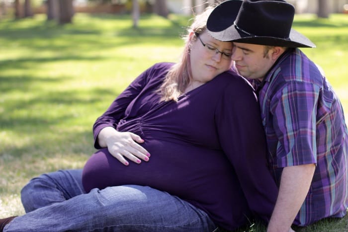 plus size maternity photo of couple