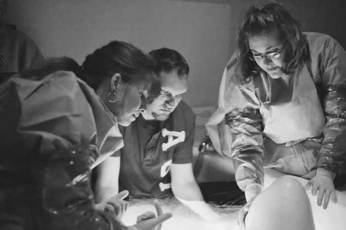 plus size woman having a water birth in a hospital