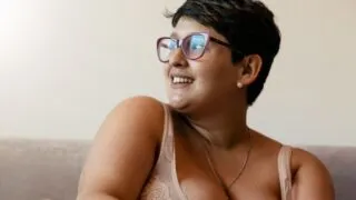 plus size woman sitting on a couch
