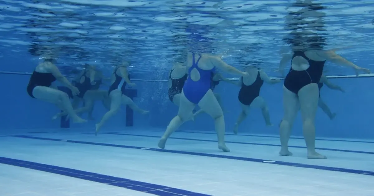 group of people doing water aerobics
