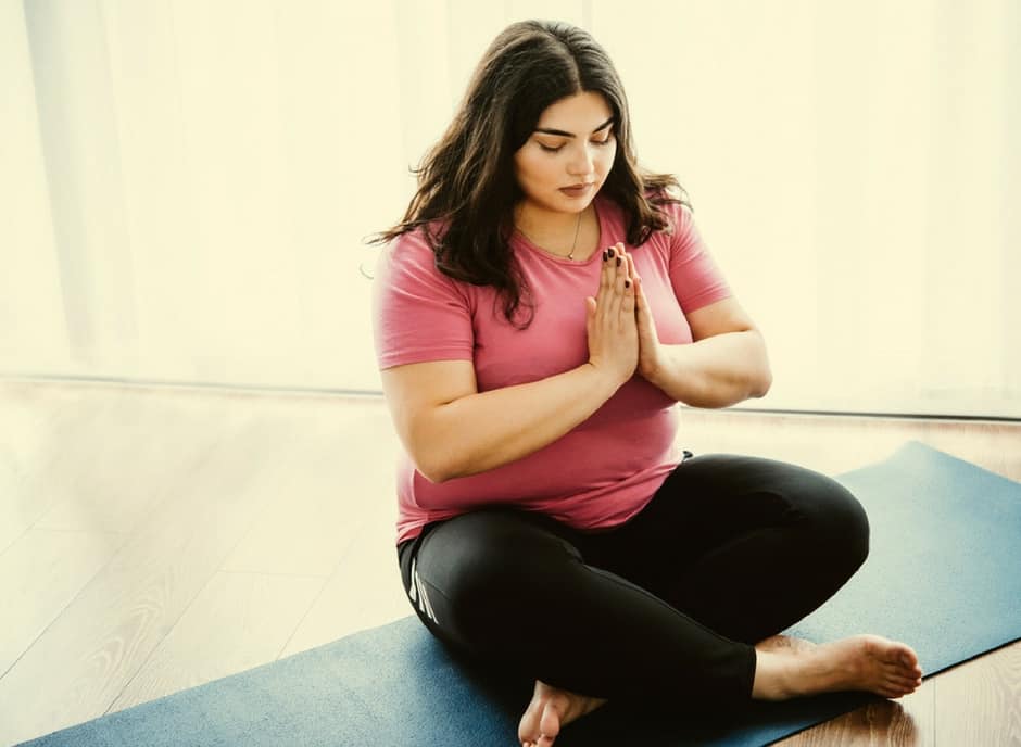 plus size woman doing yoga 