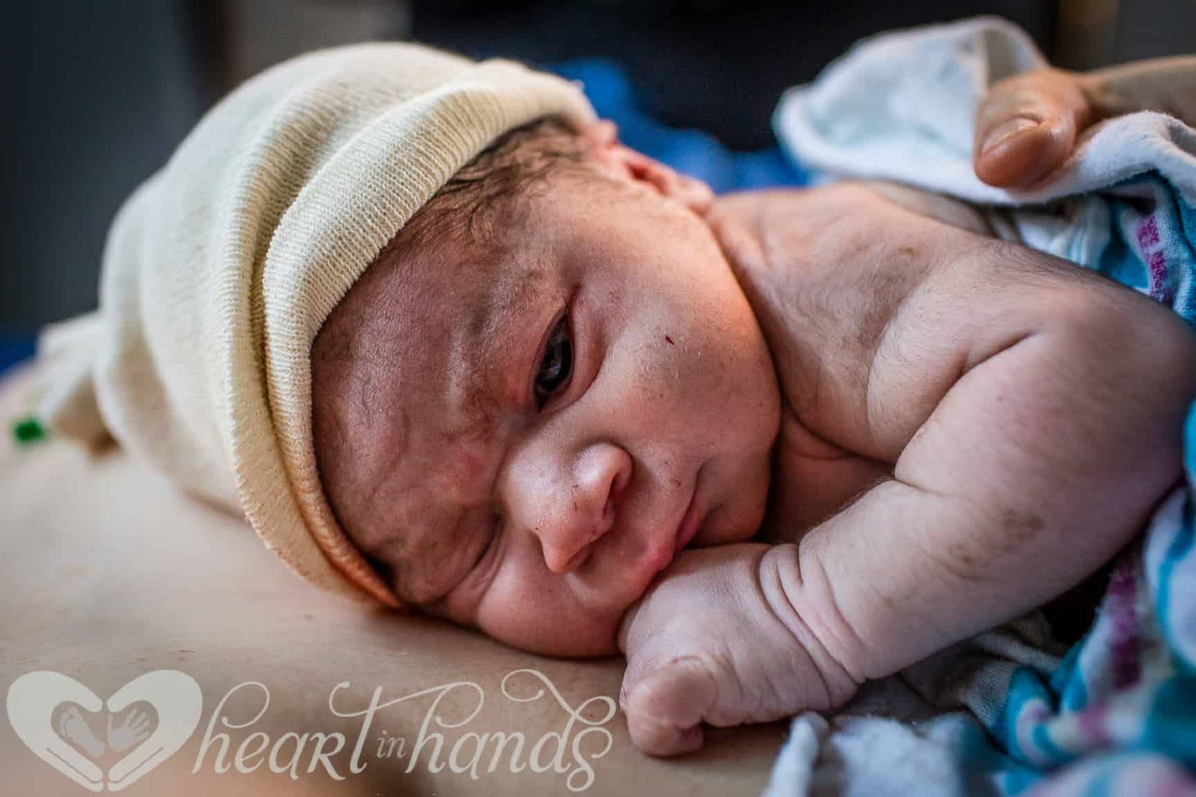 newborn baby in a birth center laying on mom's chest 