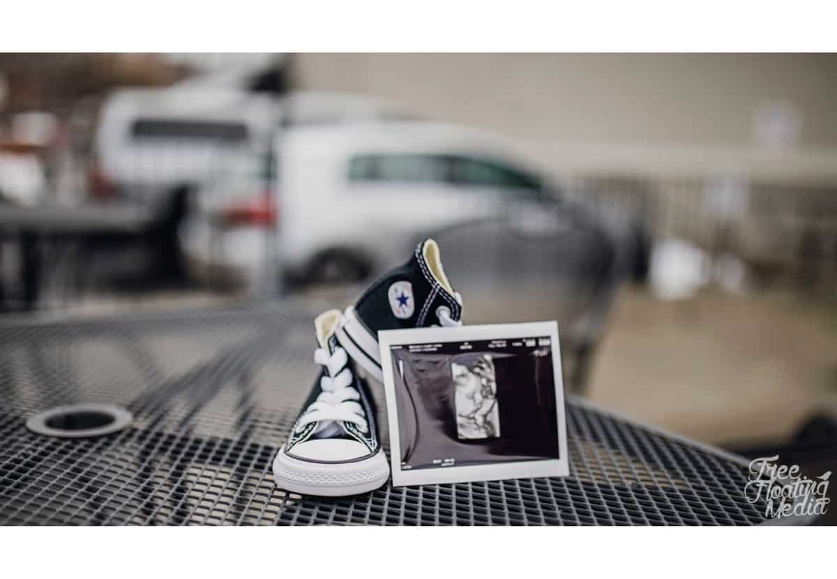 ultrasound and baby shoes maternity photo