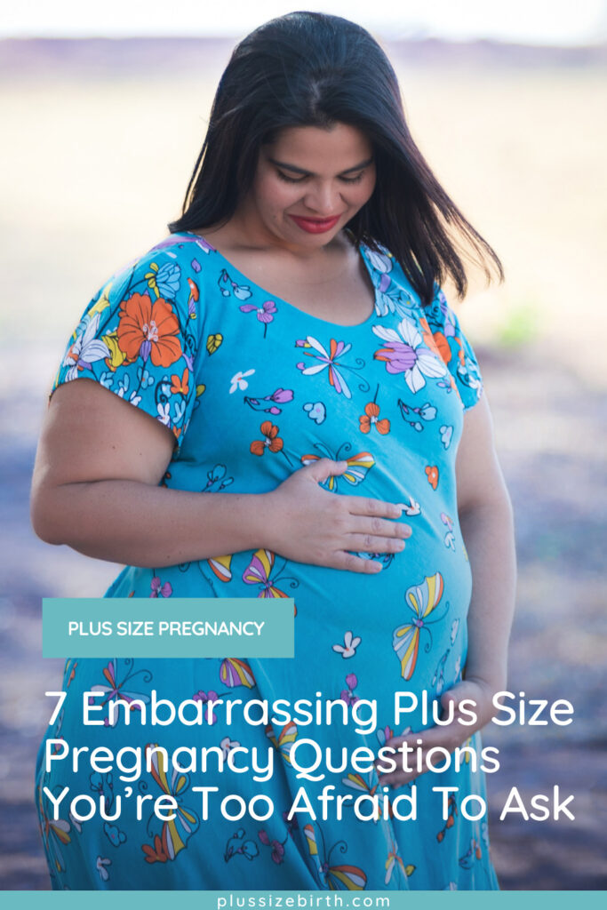 plus size pregnant woman wearing a blue maternity dress