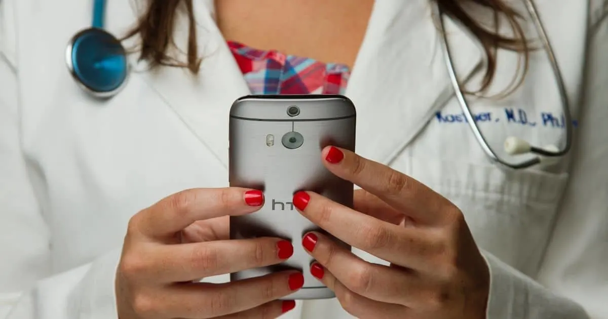 doctor holding cell phone