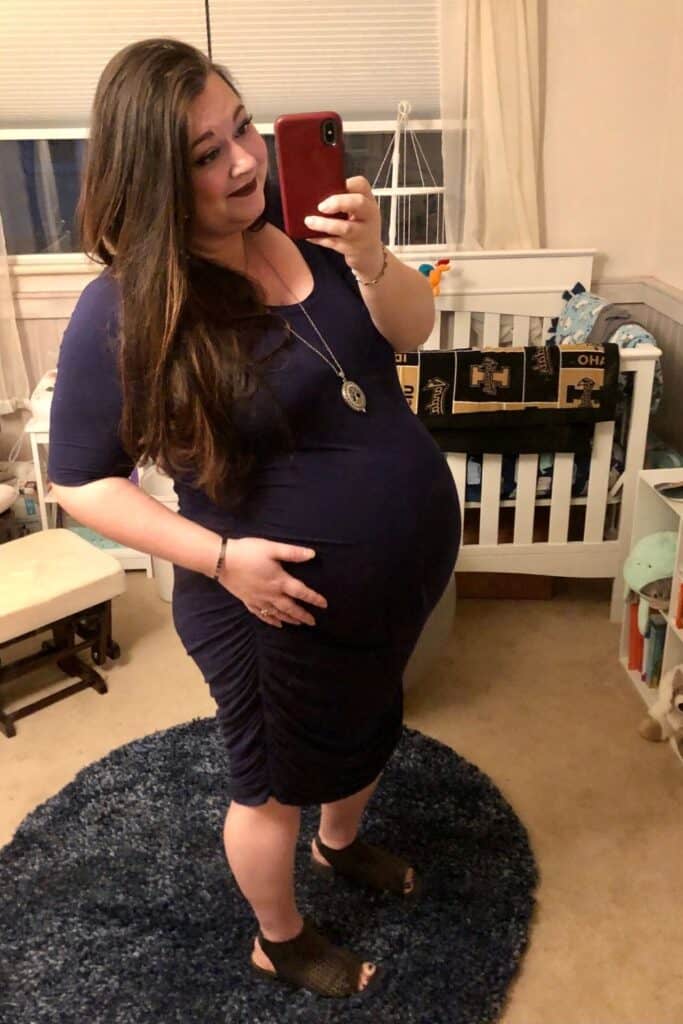 plus size woman in blue dress having a Plus-Size Pregnancy