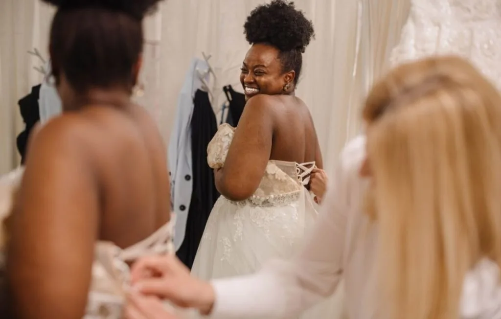 plus size pregnant woman wearing a plus size maternity wedding gown