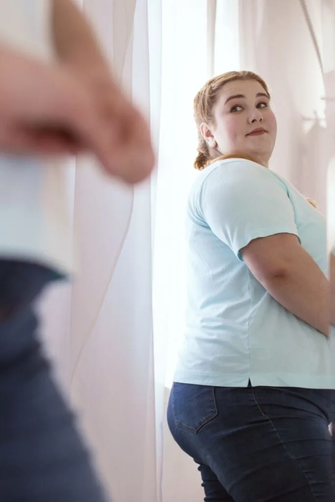 plus size woman with apron belly