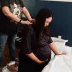 plus size woman in labor with a size-friendly doula
