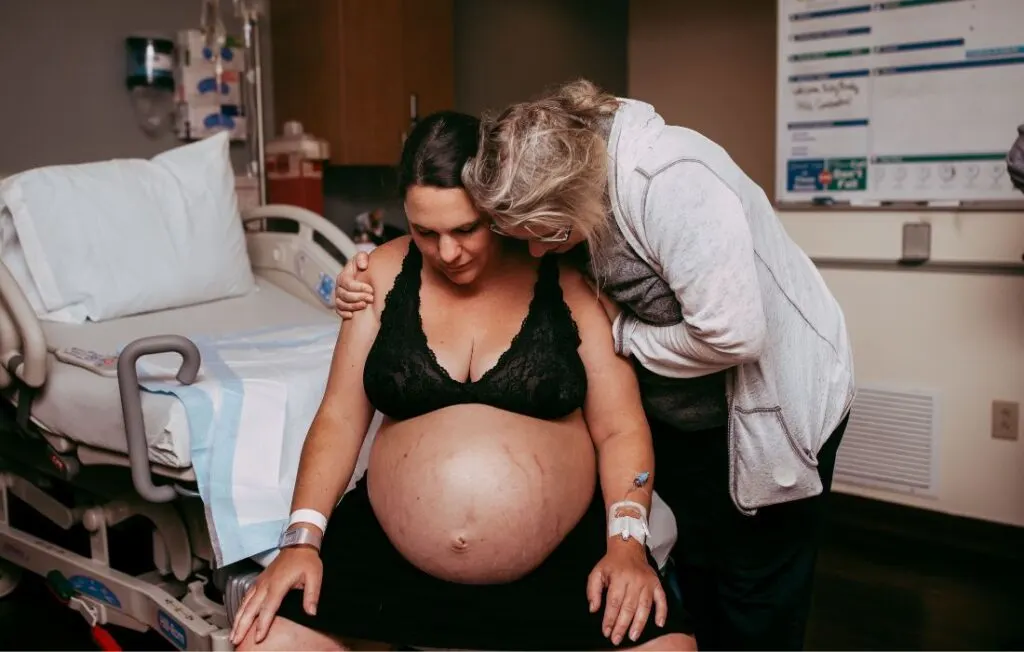 size-friendly doula offering support to a plus size woman in labor