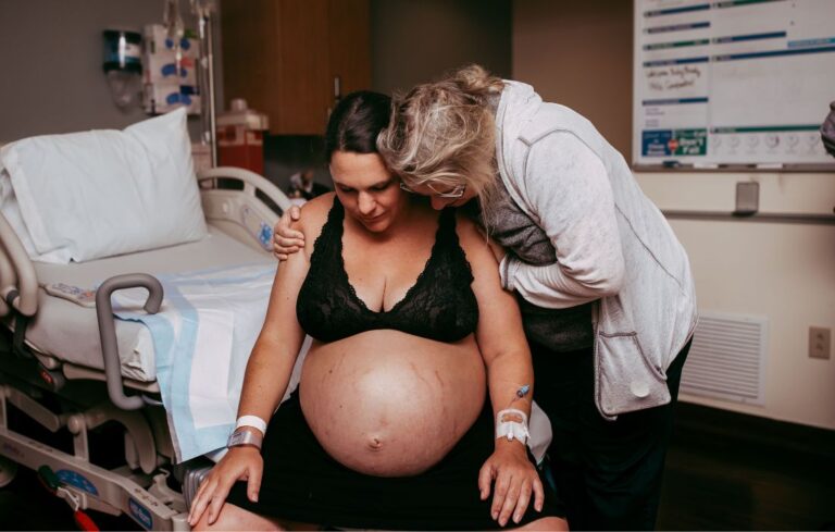 size-friendly doula offering support to a plus size woman in labor