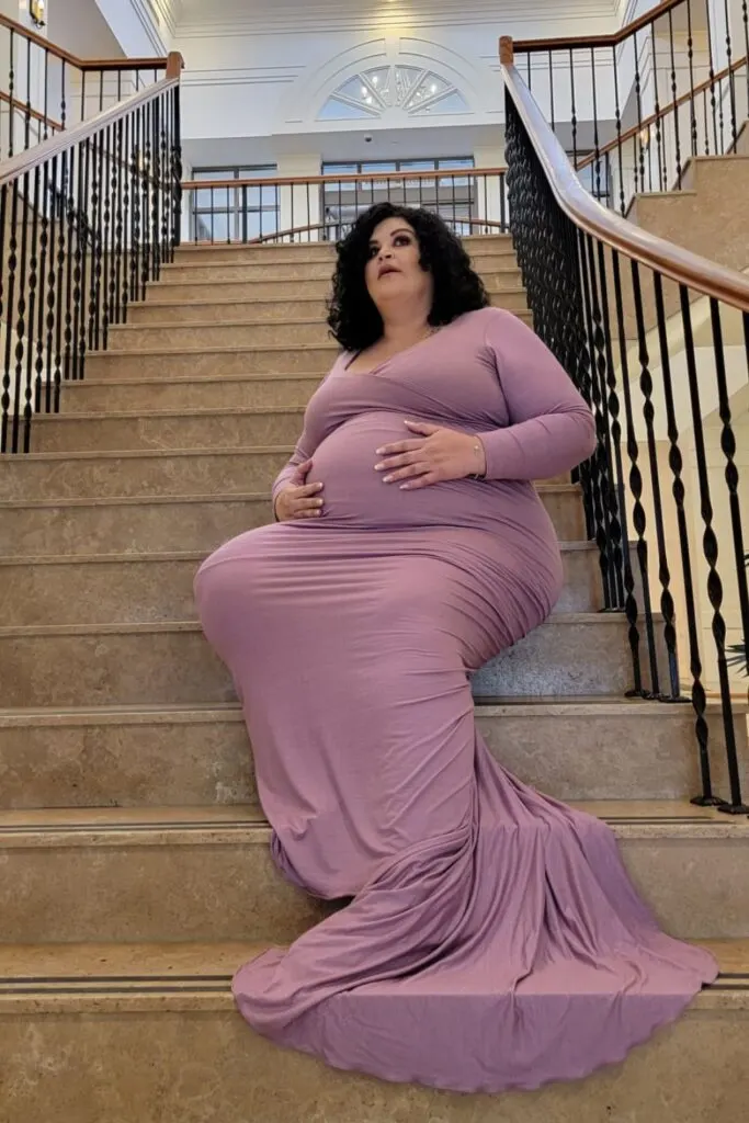 plus size maternity photo on stairs