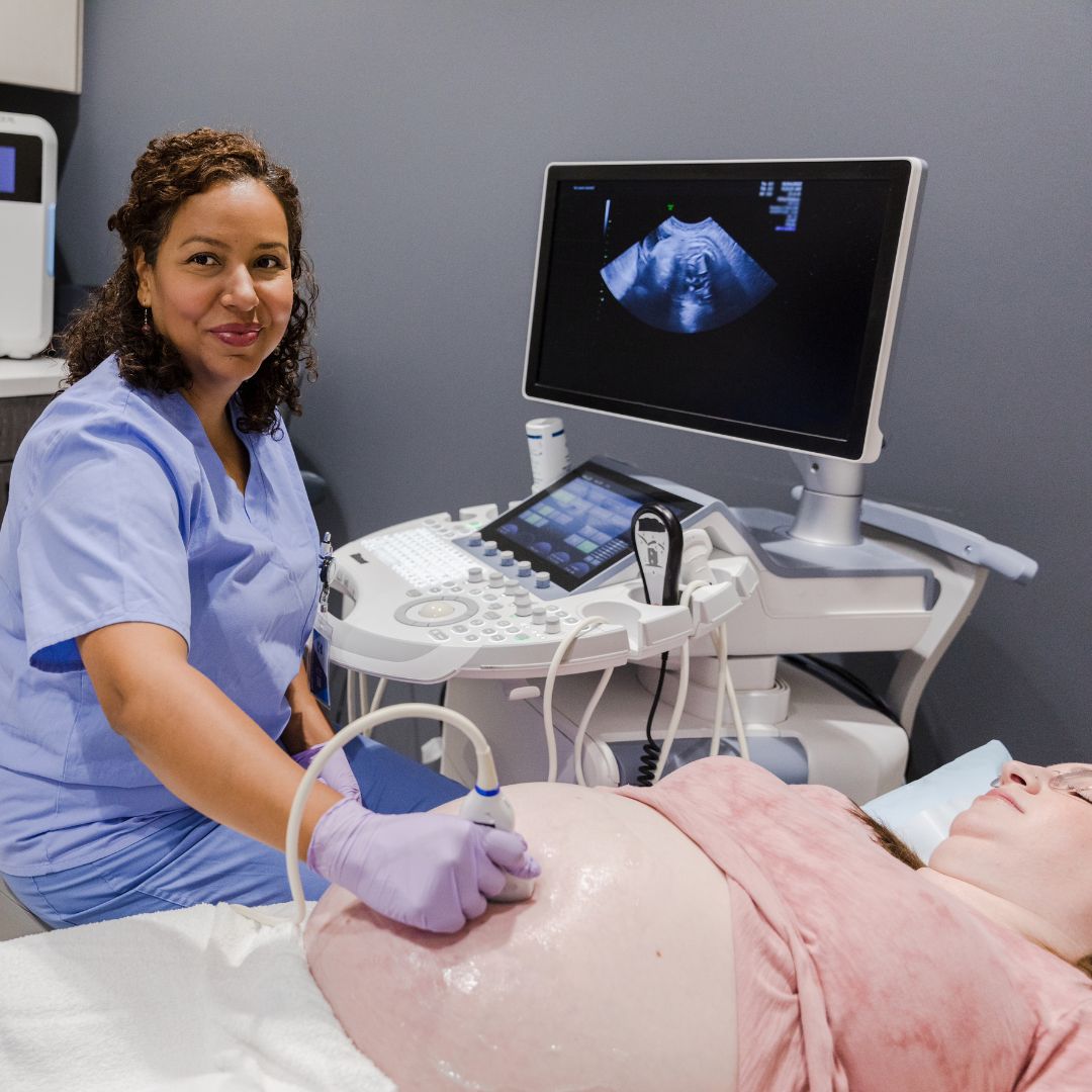 size-friendly birth professional doing an ultrasound on a plus size pregnant woman