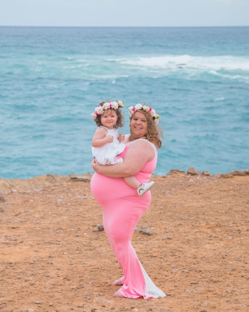 plus size maternity photo with mother and daughter on the beach